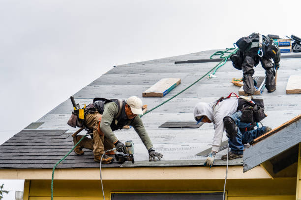 Professional Storm Damage Roof Repair technician working in West Hempstead, NY